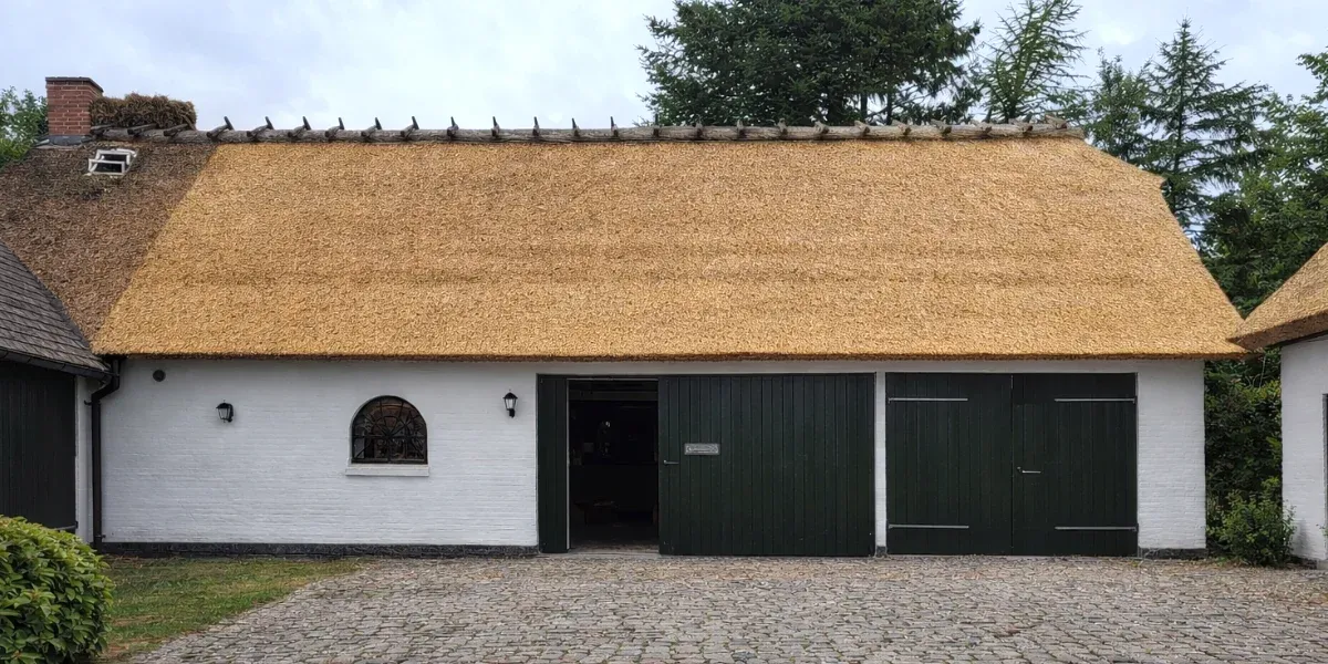 Freshly Installed Reed Thatched Roof on Traditional White House